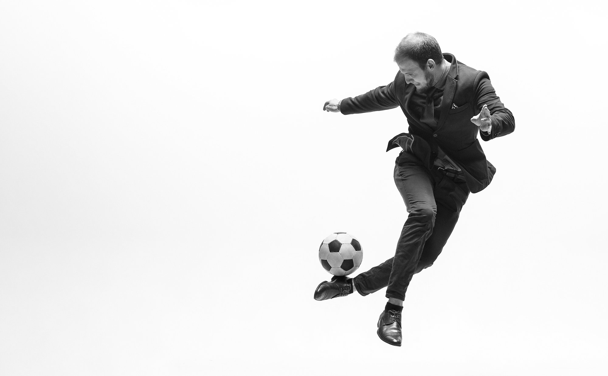  Man in a suit playing football